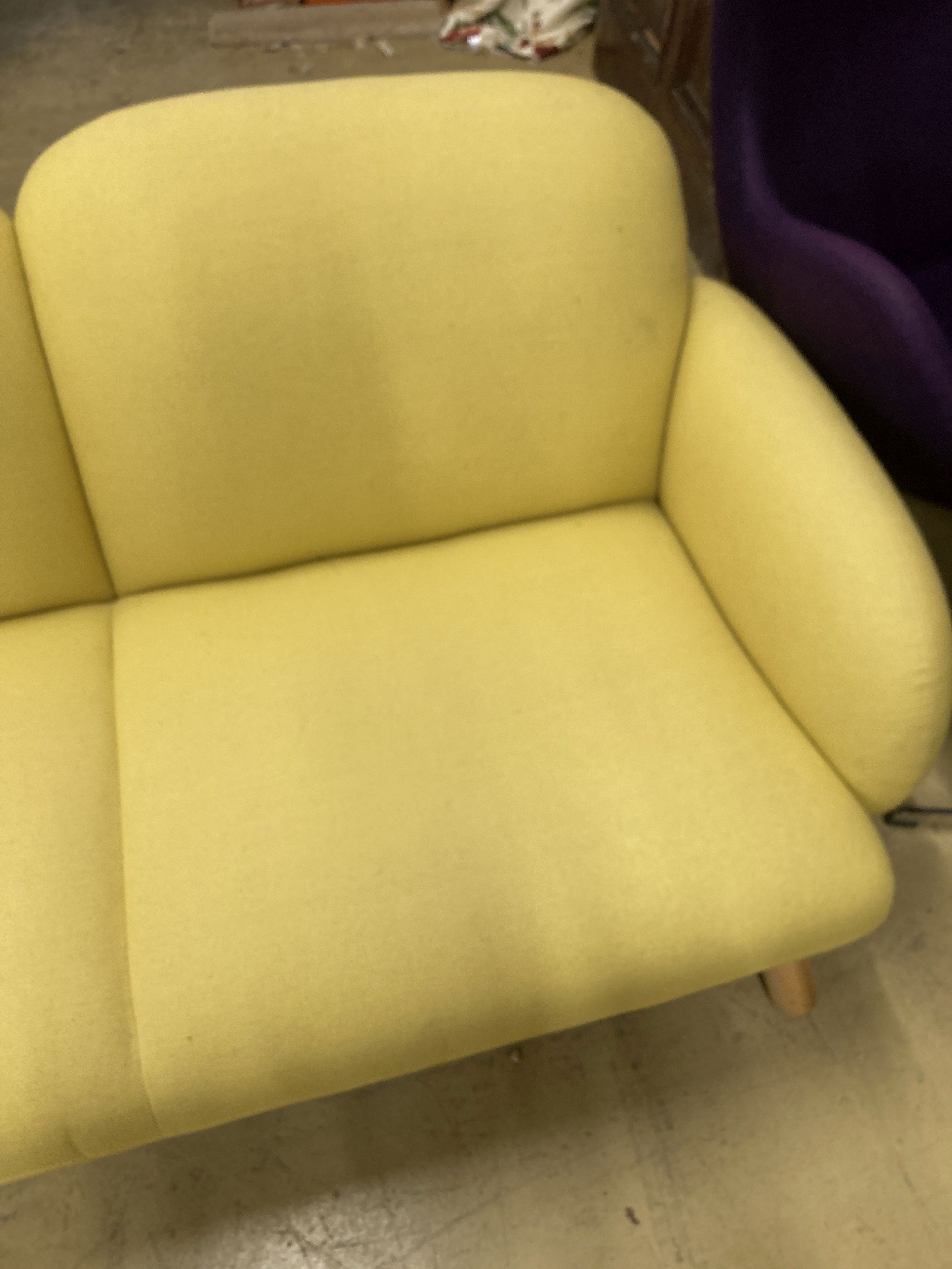 A contemporary pale yellow fabric two seater settee, length 160cm, depth 80cm, height 76cm